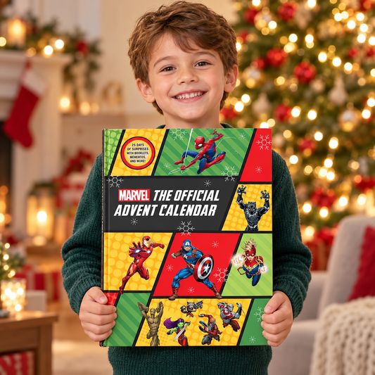 Little boy holding Marvel: The Official Advent Calendar in a Christmas setting
